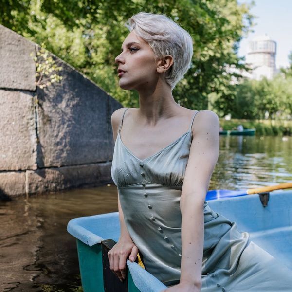 A person sitting calmly after a workout, looking refreshed.
